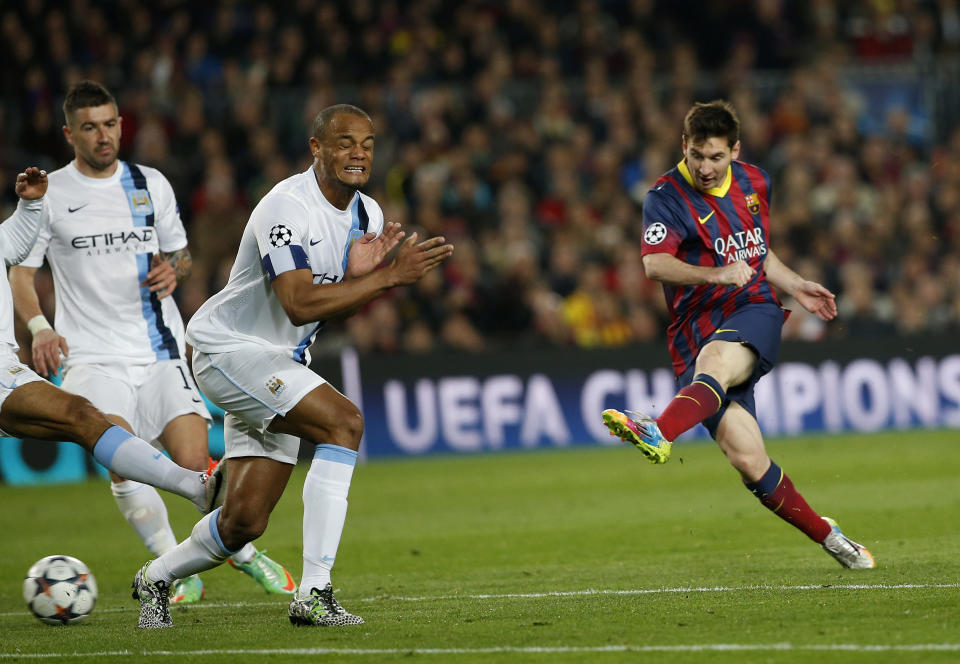 Barcelona's Lionel Messi, right shoots on goal during a Champions League, round of 16, second leg, soccer match between FC Barcelona and Manchester City at the Camp Nou Stadium in Barcelona, Spain, Wednesday March 12, 2014. (AP Photo/Emilio Morenatti)