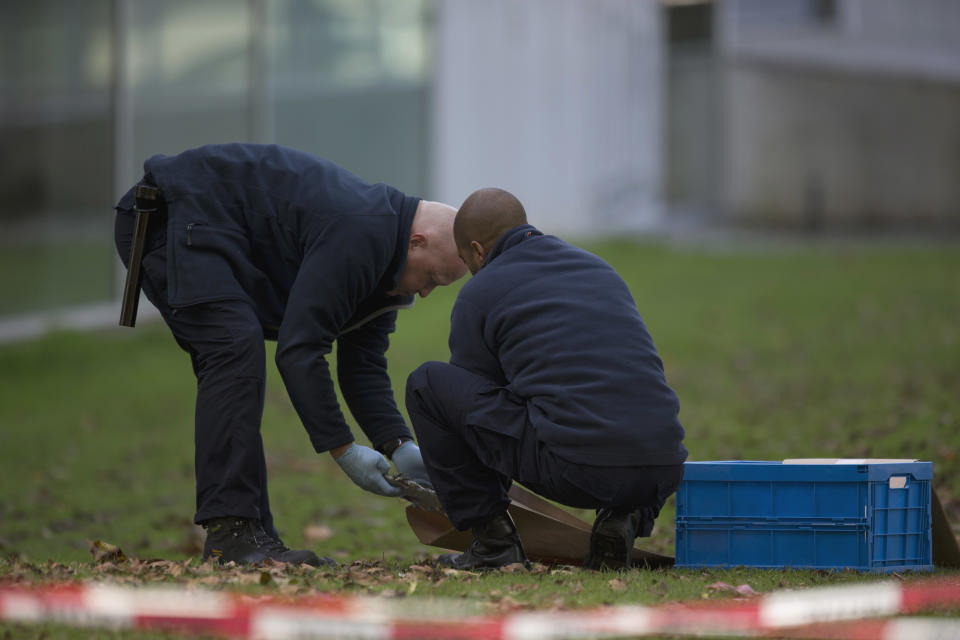 Forensic experts take samples of imprints at Kunsthal museum in Rotterdam, Netherlands, Tuesday Oct. 16, 2012.  Several paintings have been stolen from a museum in the Dutch city of Rotterdam that was exhibiting works by Pablo Picasso, Henri Matisse and Vincent van Gogh.  At least several paintings were stolen early Tuesday morning from the Kunsthal museum , but their names have not yet been released. They are believed to include at least one by Henri Matisse, the 1919 "Reading Girl." (AP Photo/Peter Dejong)