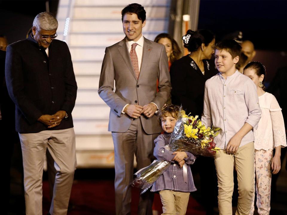 Justin Trudeau and his family are welcomed by a junior minister on arrival in India: Adnan Abidi/Reuters