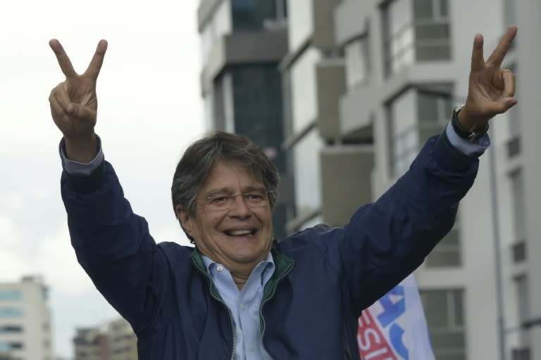 Ecuadorean presidential candidate for the CREO party Guillermo Lasso participates in a rally outside the National Electoral Council after a press conference of the President of Electoral Council Juan Pablo Pozo, in Quito on February 21, 2017