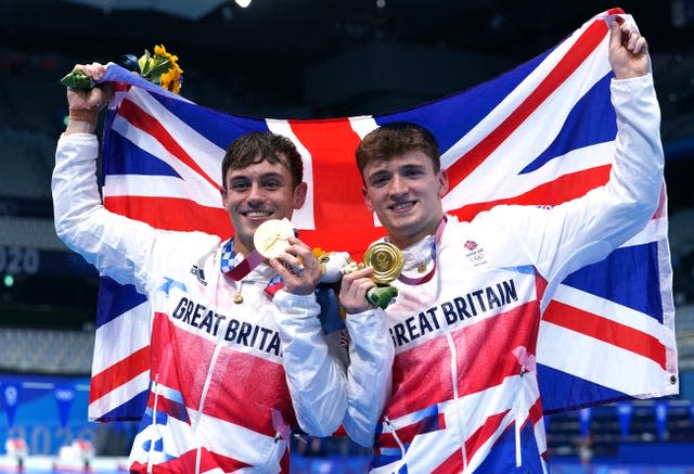 Tom Daley (left) and Matty Lee celebrate winning gold in the Men’s Synchronised 10m Platform Final at the Tokyo Aquatics Centre on the third day of the Tokyo 2020 Olympic Games in Japan