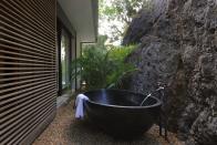 <b>Saint Barts; £12.4 million guide price </b> <br> The master bedroom is nestled against a cliff with private pool, spa and terraces and outdoor bathtub carved into the adjoining rock face. <br> <a href="http://www.knightfrank.co.uk" rel="nofollow noopener" target="_blank" data-ylk="slk:www.knightfrank.co.uk;elm:context_link;itc:0;sec:content-canvas" class="link ">www.knightfrank.co.uk</a>