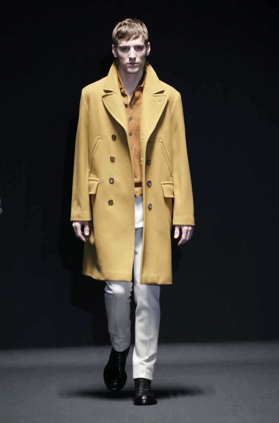 A model wears a creation for Gucci men's Fall-Winter 2013-14 collection, part of the Milan Fashion Week, unveiled in Milan, Italy, Monday, Jan. 14, 2013. (AP Photo/Antonio Calanni)