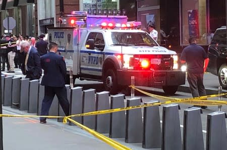 New York City police officers are seen as police said they were investigating two suspicious packages at the Fulton St. subway station in Manhattan