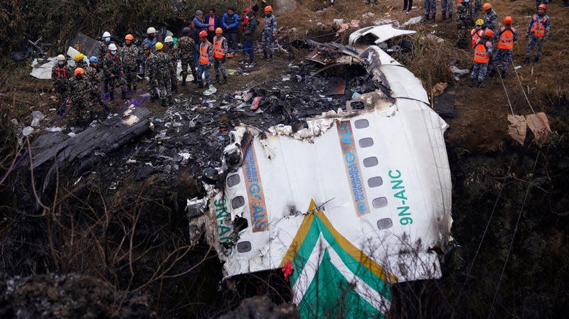 Rescuers searching the wreckage at the crash site in Pokhara, Nepal on January 16, 2023