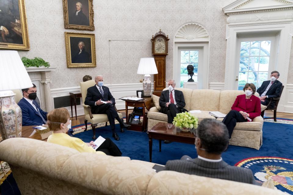 FILE - In this April 19, 2021, file photo, President Joe Biden meets with, from left, Transportation Secretary Pete Buttigieg, Rep. Kay Granger, R-Texas, Sen. Angus King, I-Maine, Rep. Emanuel Cleaver, D-Mo., Sen. Jeanne Shaheen, D-N.H., Sen. John Hickenlooper, D-Colo., and other members of congress to discuss his jobs plan in the Oval Office of the White House in Washington. The outreach to Congress is nothing new for presidents, but Biden is a veteran of Capitol Hill who knows how to tap the desire of even the most partisan legislators to legislate. (AP Photo/Andrew Harnik)