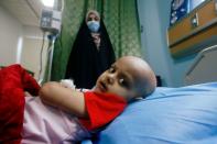 A child who suffers from cancer lies on a bed at the Children's Hospital for Cancer Diseases in Basra