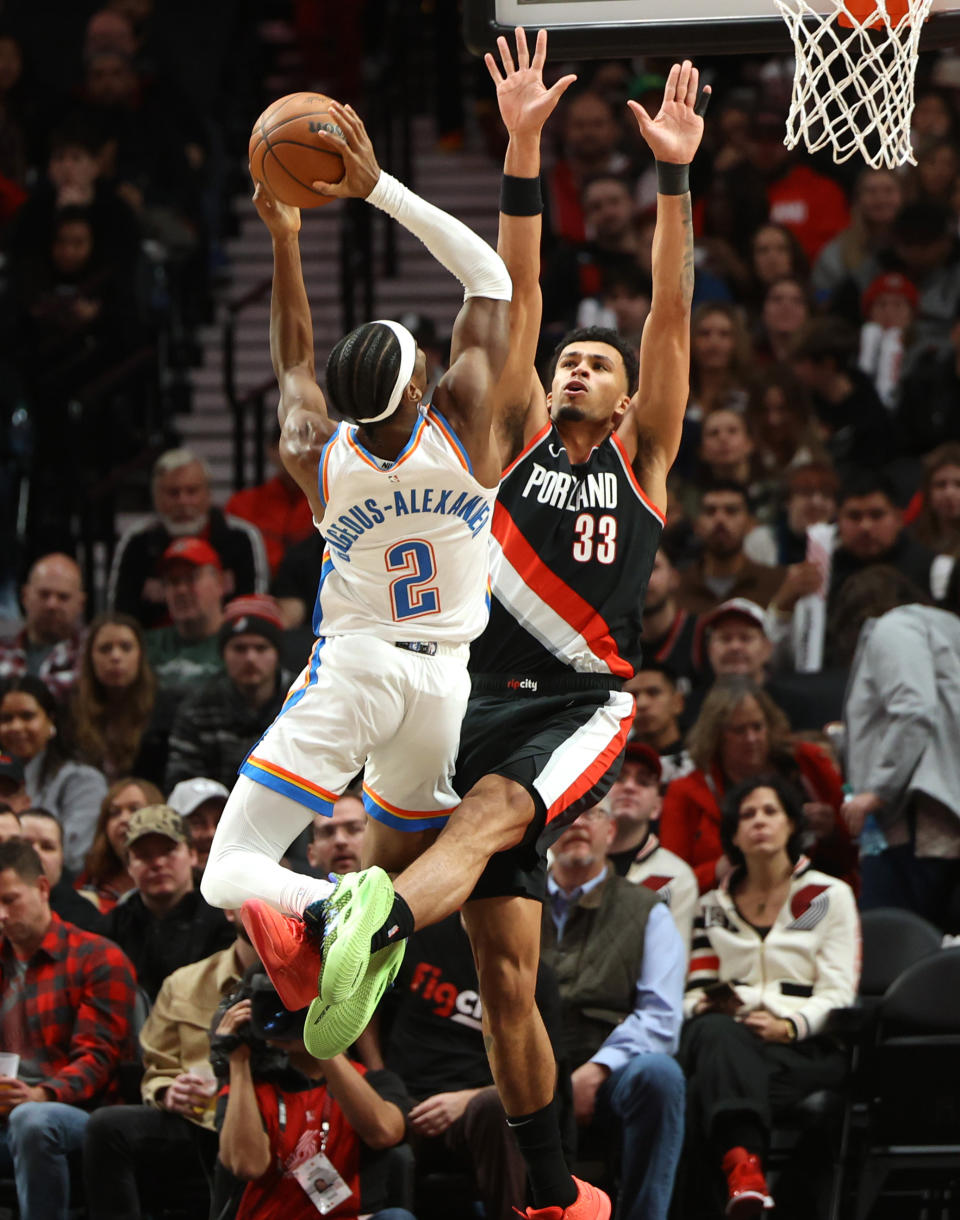 Nov 19, 2023; Portland, Oregon, USA; Portland Trail Blazers forward <a class="link " href="https://sports.yahoo.com/nba/players/10065" data-i13n="sec:content-canvas;subsec:anchor_text;elm:context_link" data-ylk="slk:Toumani Camara;sec:content-canvas;subsec:anchor_text;elm:context_link;itc:0">Toumani Camara</a> (33) defends Oklahoma City Thunder guard Shai Gilgeous-Alexander (2) in the first half at Moda Center. Mandatory Credit: Jaime Valdez-USA TODAY Sports