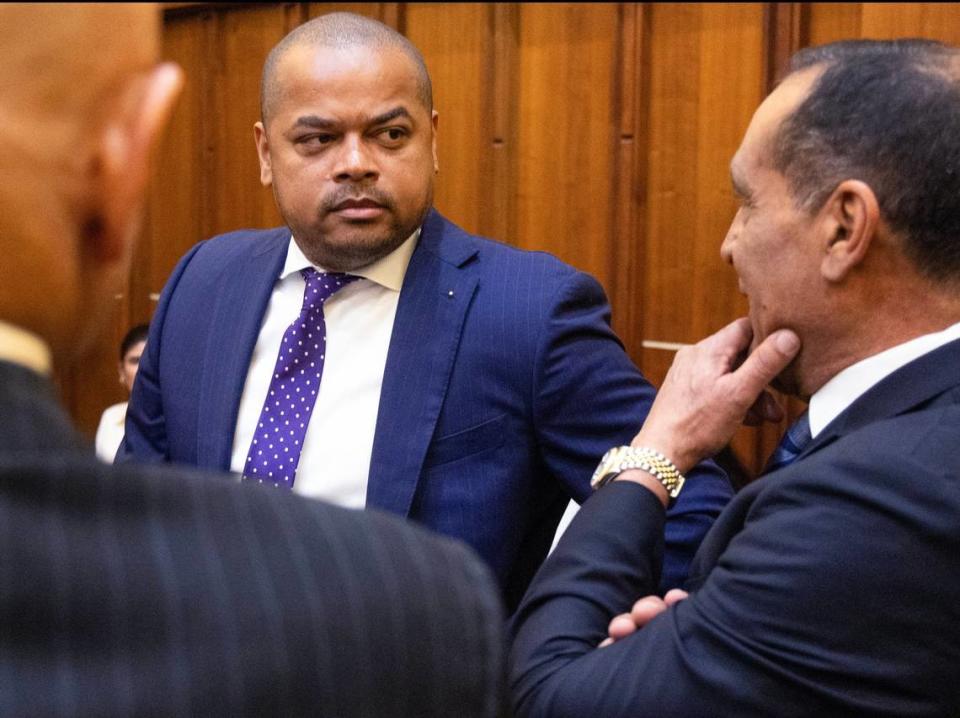 Suspended Miami-Dade Commissioner Joe Martinez, right, introduces Miami-Dade Commissioner Keon Hardemon, center, as he appears in court during jury selection of Martinez’s public corruption trial at the Richard E. Gerstein Justice Building on Thursday, April 11, 2024, in Miami, Florida. Carl Juste/cjuste@miamiherald.com