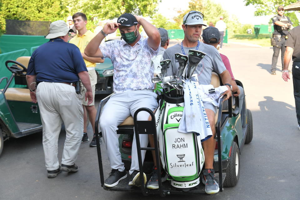 Jon Rahm of Spain gets shuttled away after testing positive for COVID-19 after the third round of the Memorial Tournament