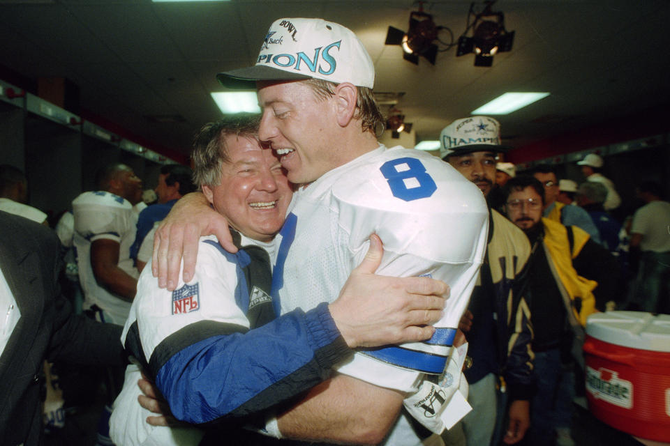 FILE - Dallas Cowboys' head coach Jimmy Johnson hugs quarterback Troy Aikman in their locker room after defeating the Buffalo Bills 30-13 in Super Bowl XXVIII at the Georgia Dome in Atlanta, Jan. 30, 1994. Dallas and Buffalo had the only Super Bowl rematch in consecutive seasons, meeting at the end of the 1992 and 1993 campaigns. The Cowboys got the best of both. (AP Photo/Charles Krupa, File)