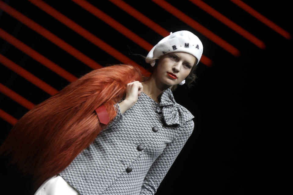 A model wears a creation as part of the Emporio Armani women's Fall-Winter 2019-2020 collection, that was presented in Milan, Italy, Thursday, Feb.21, 2019. (AP Photo/Luca Bruno)