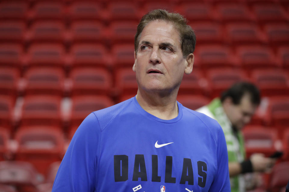 Dallas Mavericks owner Mark Cuban watches players warm up before the start of an NBA basketball game against the Miami Heat, Friday, Feb. 28, 2020, in Miami. (AP Photo/Wilfredo Lee)