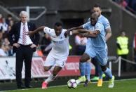 Britain Soccer Football - Swansea City v Stoke City - Premier League - Liberty Stadium - 22/4/17 Swansea City's Jordan Ayew in action with Stoke City's Bruno Martins Indi Reuters / Rebecca Naden Livepic