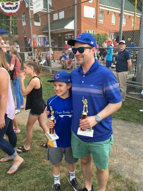 Steve Borelli and his son, Liam, enjoy a Little League awards presentation. Winning can be exhilarating, he says, but there are so many more lessons in youth sports.