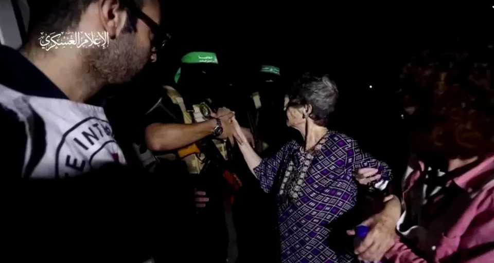 Yocheved Lifshitz shakes hands with a Hamas militant in this video screengrab obtained by Reuters on Oct. 23, 2023.  / Credit: Al-Qassam Brigades, military wing of Hamas/Handout via REUTERS