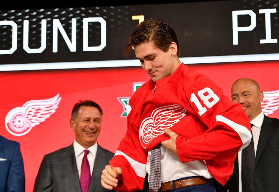 Filip Zadina puts on a Detroit Red Wings jersey after being selected as the No. 6 overall pick in the first round of the 2018 NHL draft at American Airlines Center in Dallas on June 22.