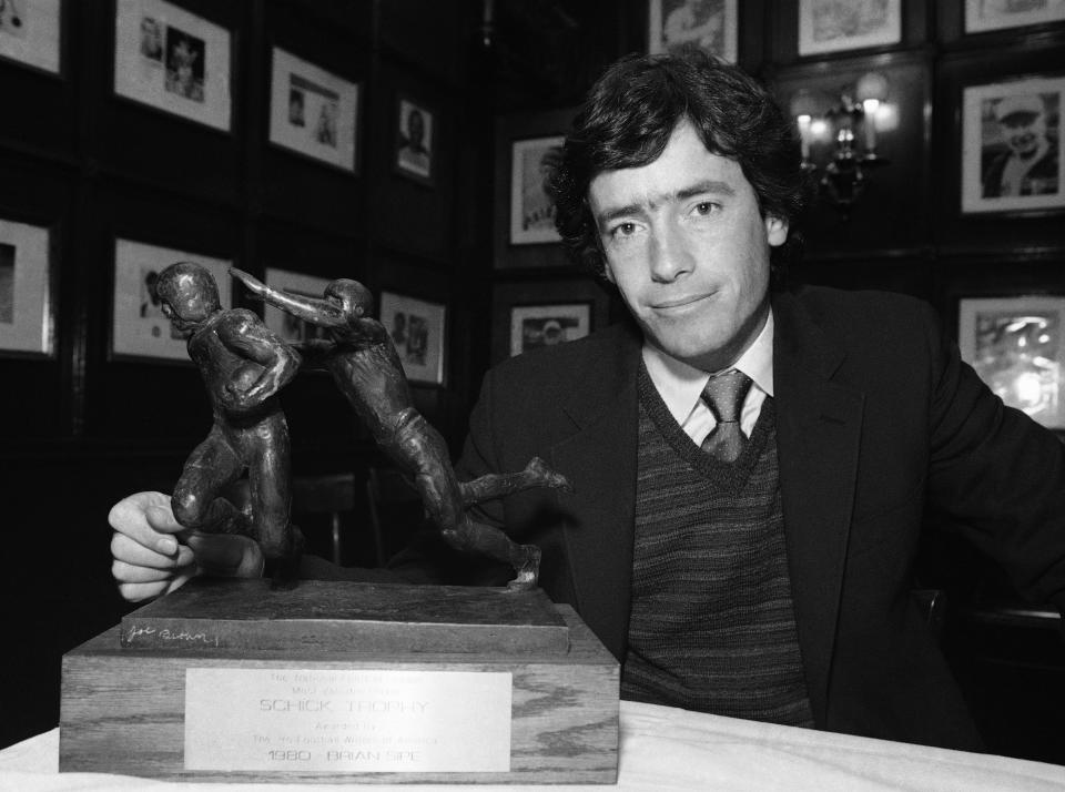 Brian Sipe of the Cleveland Browns stands next to his award Tuesday, Jan. 13, 1981 in New York after he was named the NFL Most Valuable Player for the 1980 season by the Professional Football Writers of America. (AP Photo/Dave Pickoff)