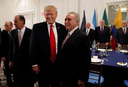 U.S. President Donald Trump meets Brazil President Michel Temer (center R) during a working dinner with Latin American leaders in New York, U.S., September 18, 2017. REUTERS/Kevin Lamarque