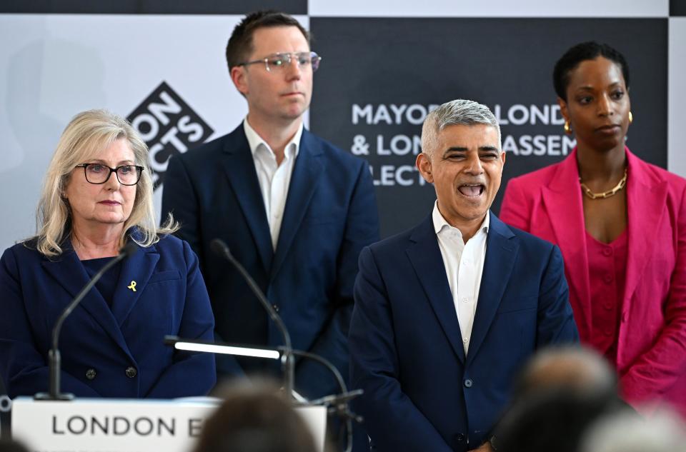 Sadiq Khan chuckles on stage at City Hall (Getty Images)