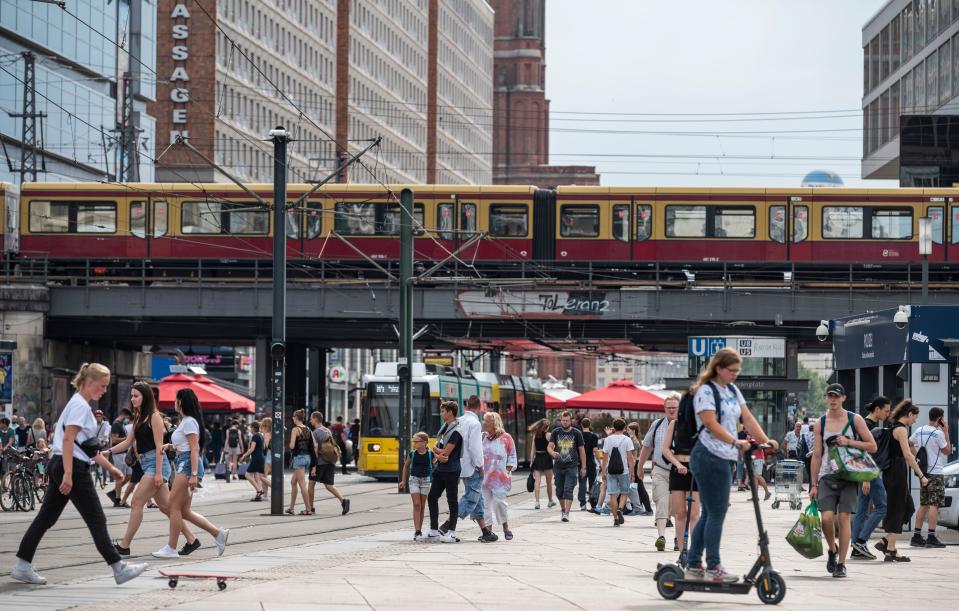 Crowds gather in Berlin's central shopping district of Alexanderplatz on August 14, 2020, amid a Coronavirus COVID-19 pandemic. - With Covid-19 cases surging in Germany as many residents return from holidays abroad, authorities are declaring nearly all of Spain, including the tourist island of Mallorca, a coronavirus risk region. (Photo by John MACDOUGALL / AFP) (Photo by JOHN MACDOUGALL/AFP via Getty Images)