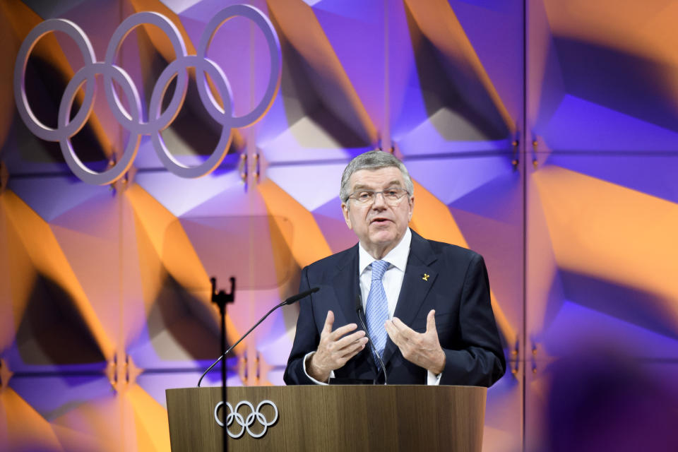 Thomas Bach, president of the International Olympic Committee (IOC), delivers a speech during the 135th Session of the IOC on the sideline of the the 3rd Winter Youth Olympic Games Lausanne 2020, at the SwissTech Convention Centre, in Lausanne, Switzerland, Friday, Jan. 10, 2020. (Laurent Gillieron/Keystone via AP)