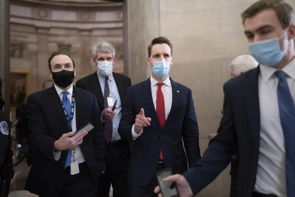 After violent protesters loyal to President Donald Trump stormed the U.S. Capitol today, Sen. Josh Hawley, R-Mo., walks to the House chamber to challenge the results of the presidential election in Pennsylvania during the joint session of the House and Senate to count the Electoral College votes cast in November's election, at the Capitol in Washington, Wednesday, Jan. 6, 2021. (AP Photo/J. Scott Applewhite)