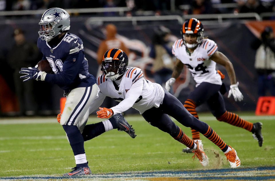 CHICAGO, ILLINOIS - DECEMBER 05: Running back Ezekiel Elliott #21 of the Dallas Cowboys carries the ball against the defense of free safety Eddie Jackson #39 of the Chicago Bears during the game at Soldier Field on December 05, 2019 in Chicago, Illinois. (Photo by Jonathan Daniel/Getty Images)