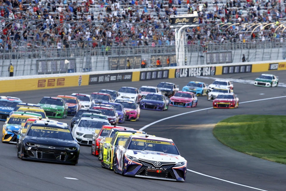 Drivers restart after a caution during a NASCAR Cup Series auto race at Las Vegas Motor Speedway. Sunday, Sept. 26, 2021, in Las Vegas. (AP Photo/Steve Marcus)