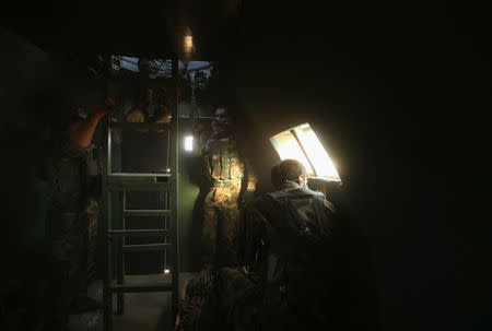 Members of the Peshmerga forces are seen inside a military vehicle north of Mosul, during an operation to attack Islamic State militants in Mosul. REUTERS/Ari Jalal