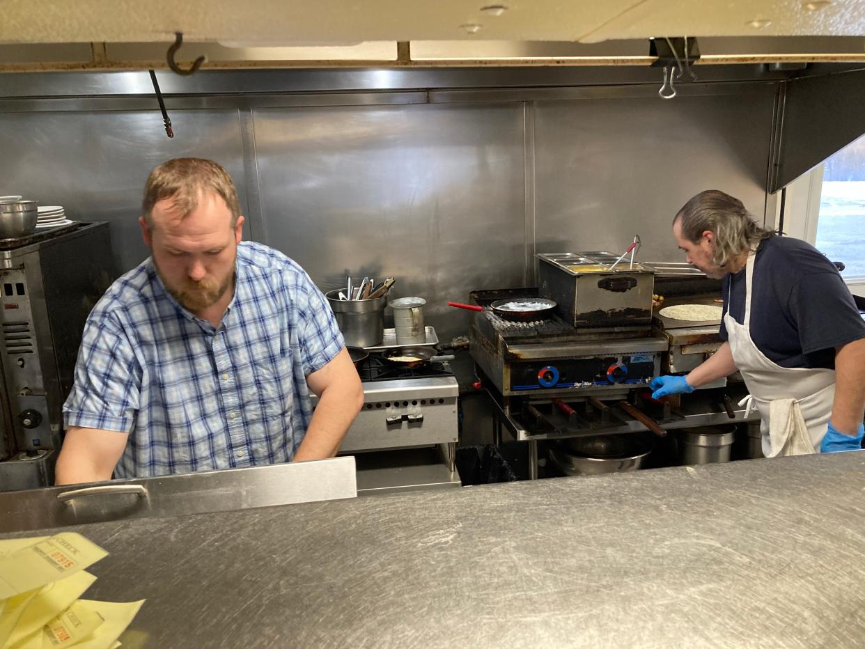 Michael Bissonette, left, co-owner of The Dutch Mill Diner in Shelburne, and Rich Cross work in the kitchen Jan. 26, 2024.