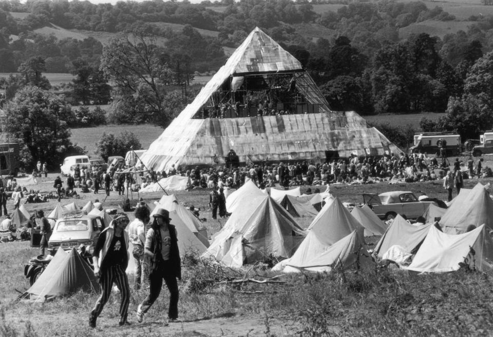 June 1971:  Hippies at the second Glastonbury Festival, which saw the first use of a pyramid stage (Getty Images)
