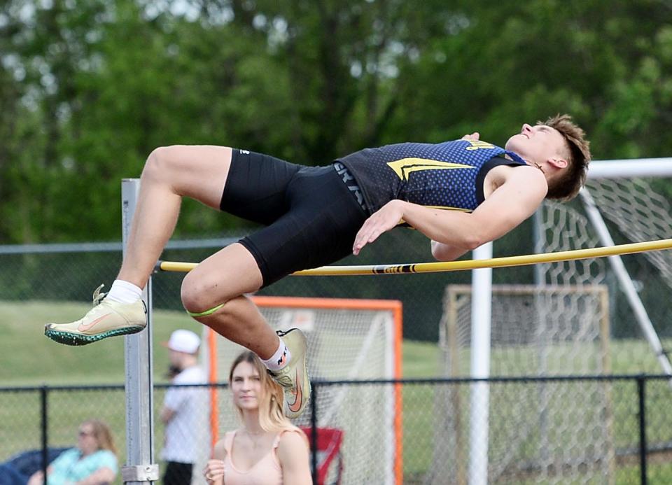 Clear Spring's Jacob Faith clears the bar at 6 feet, 2 inches to win the boys high jump during the Washington County Track & Field Championships at North Hagerstown.