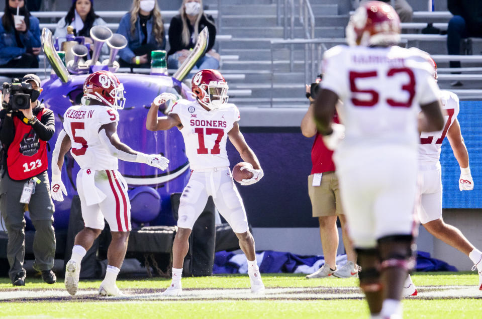 Oklahoma Sooners wide receiver Marvin Mims (17) celebrates scoring a touchdown during the first half of an NCAA College football game against TCU, Saturday, Oct. 24, 2020, in Fort Worth, Texas. (AP Photo/Brandon Wade)