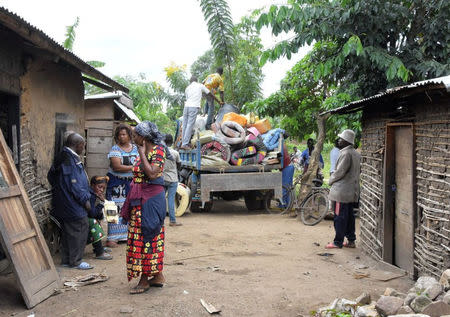 Civilians prepare to flee from their home following an attack by suspected Islamist rebels who killed at least 11 civilians in Beni, Democratic Republic of Congo, March 28, 2018. REUTERS/Stringer