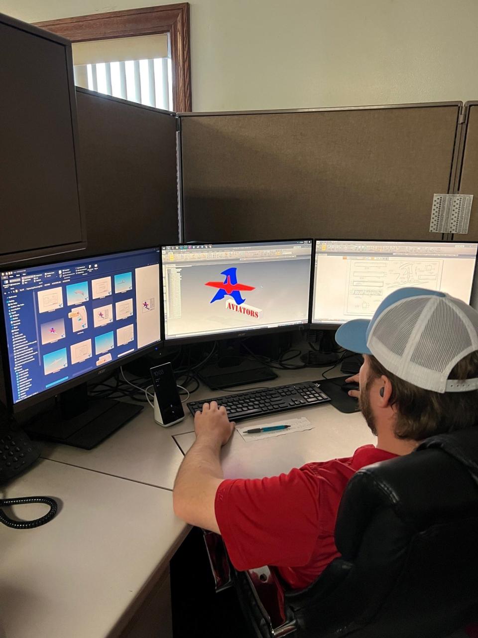 James Faulkner in MAC Trailer's engineering department works on a project design.