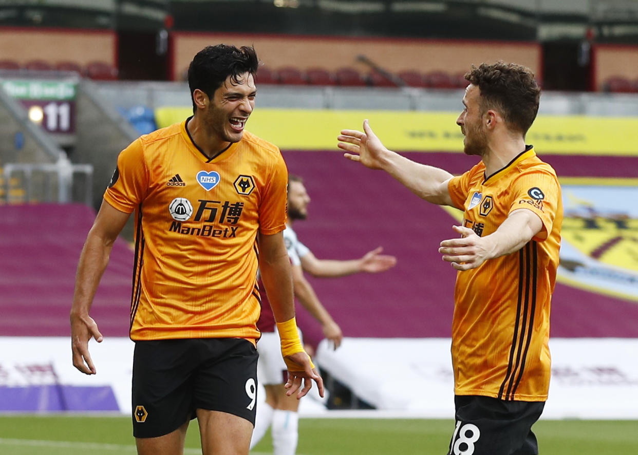 Soccer Football - Premier League - Burnley v Wolverhampton Wanderers - Turf Moor, Burnley, Britain - July 15, 2020  Wolverhampton Wanderers' Raul Jimenez celebrates scoring their first goal with Diogo Jota, as play resumes behind closed doors following the outbreak of the coronavirus disease (COVID-19)  REUTERS / Jason Cairnduff / Pool  EDITORIAL USE ONLY. No use with unauthorized audio, video, data, fixture lists, club/league logos or "live" services. Online in-match use limited to 75 images, no video emulation. No use in betting, games or single club/league/player publications.  Please contact your account representative for further details.