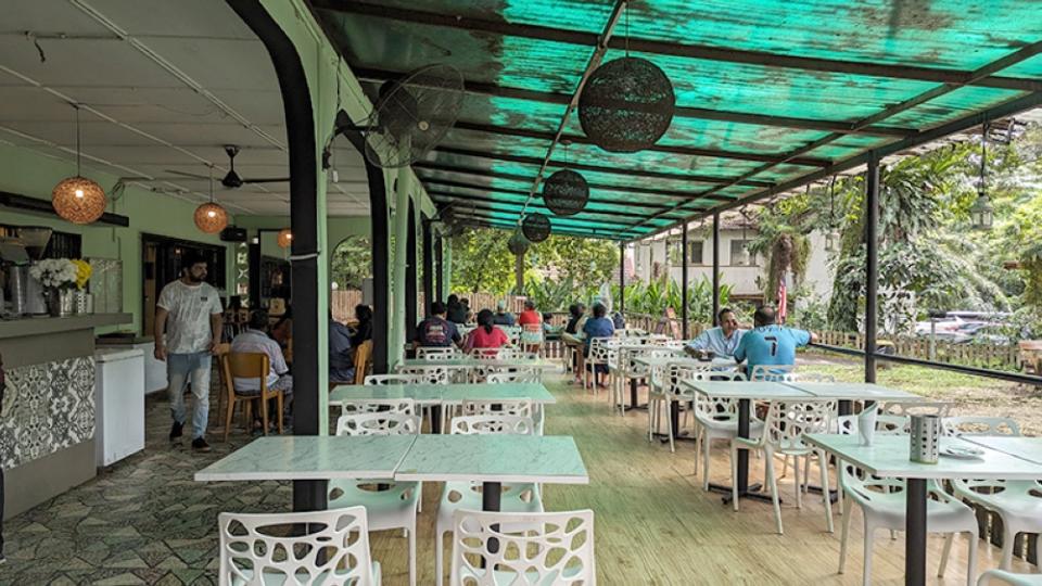 The covered seating area, with indoor seating to the left and the smoking area to the right.