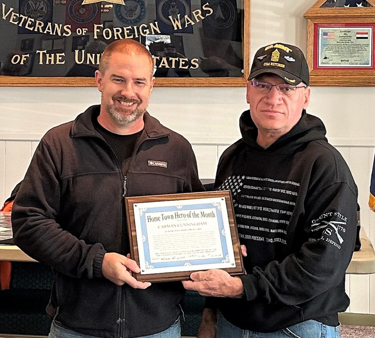 Coast Guard veteran Carman Cunningham (left) was named Cheboygan County's Hometown Hero for the month of May.