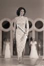 <p>With a form-fitting dress and coiffed '80s hair, Miss Arkansas, Elizabeth Ward, took home the 1982 title for Miss America. Her dress, which leaned on the subtle side, was a departure from the glitz and glam of previous winners.</p>