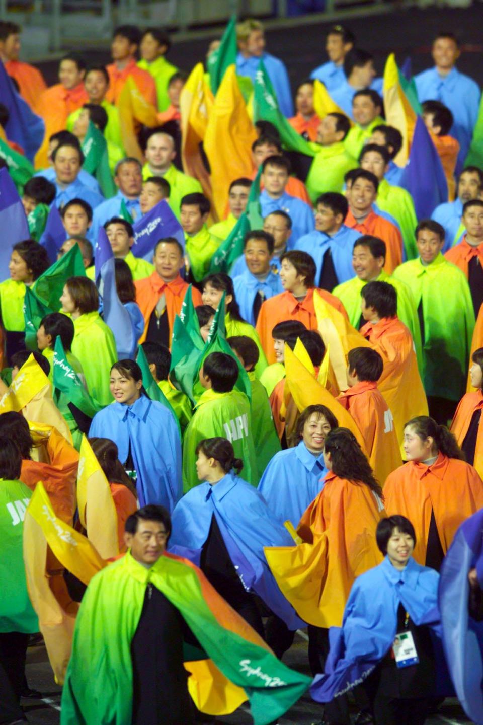 japan's olympic team in 2000 dressed in colorful capes