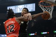 Milwaukee Bucks' Giannis Antetokounmpo fouls Chicago Bulls' Ayo Dosunmu during the first half of an NBA basketball game Friday, Jan. 21, 2022, in Milwaukee. (AP Photo/Morry Gash)