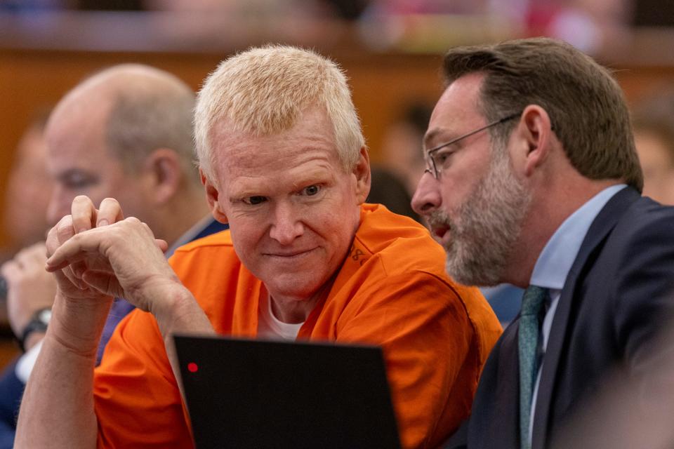 Alex Murdaugh, left, confers with Phil Barber during a judicial hearing at the Richland County Judicial Center in Columbia, S.C., Monday, Jan. 29, 2024. (Tracy Glantz/The State via AP, Pool)