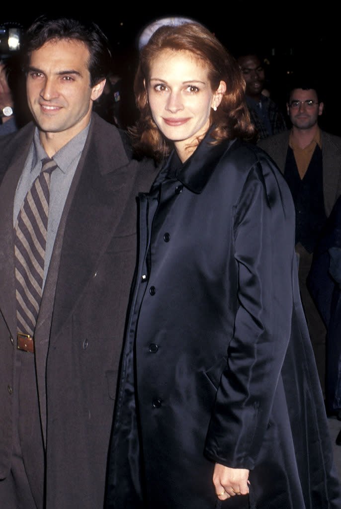 <p>Accompanied by new beau, fitness trainer Pat Manocchia, Roberts arrives at the premiere of her historical biopic <i>Michael Collins </i>on October 10, 1996. (Photo: Ron Galella/WireImage)</p>