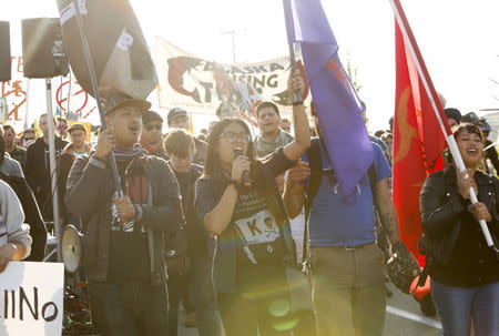 Activists march and rally at the entrance of Terminal 5 at the Port of Seattle, Washington May 18, 2015. Shell's second drilling rig was due to dock at the Port of Seattle in coming days. REUTERS/Jason Redmond