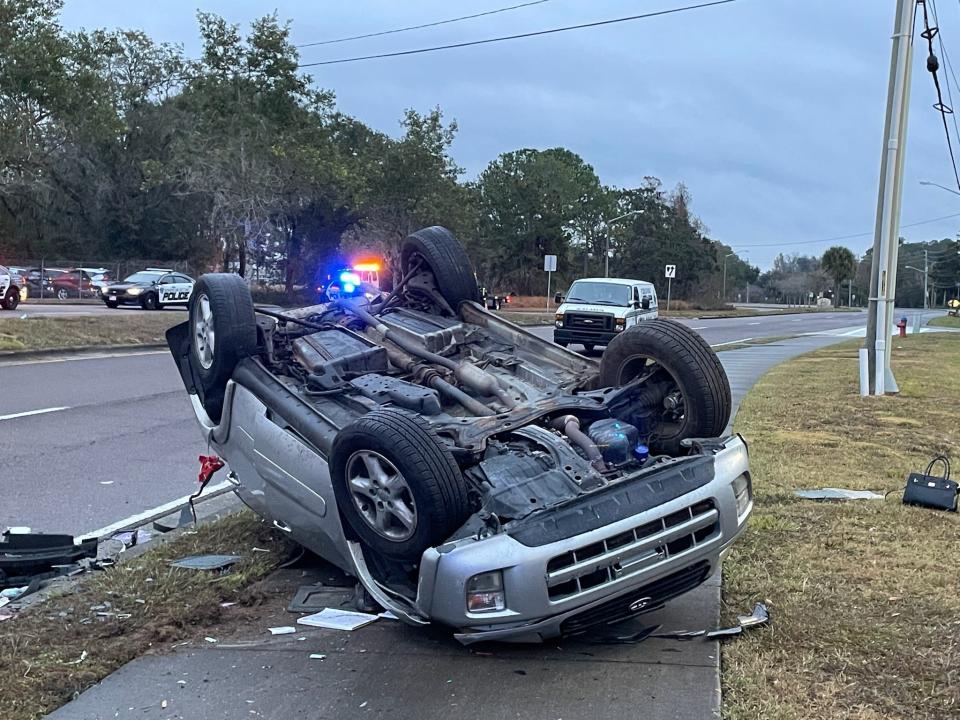 An overturned SUV on the sidewalk on Tuesday.