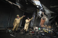 Fire fighters douse a fire at Gokul Puri tyre market which was burnt in Tuesday's violence in New Delhi, India, Wednesday, Feb. 26, 2020. At least 20 people were killed in three days of clashes in New Delhi, with the death toll expected to rise as hospitals were overflowed with dozens of injured people, authorities said Wednesday. The clashes between Hindu mobs and Muslims protesting a contentious new citizenship law that fast-tracks naturalization for foreign-born religious minorities of all major faiths in South Asia except Islam escalated Tuesday. (AP Photo/Altaf Qadri)