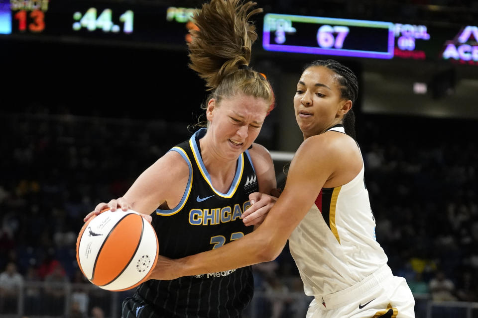 Las Vegas Aces' Kiah Stokes, right, pressures Chicago Sky's Emma Meesseman during the second half of the WNBA Commissioner's Cup basketball game Tuesday, July 26, 2022, in Chicago. The Aces won 93-83. (AP Photo/Charles Rex Arbogast)