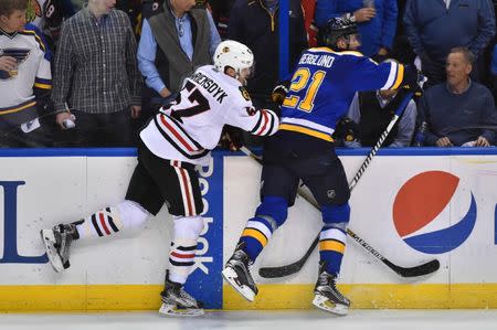 Apr 25, 2016; St. Louis, MO, USA; Chicago Blackhawks defenseman Trevor van Riemsdyk (57) checks St. Louis Blues center Patrik Berglund (21) during the third period in game seven of the first round of the 2016 Stanley Cup Playoffs at Scottrade Center. The St. Louis Blues defeat the Chicago Blackhawks 3-2. Mandatory Credit: Jasen Vinlove-USA TODAY Sports / Reuters Picture Supplied by Action Images