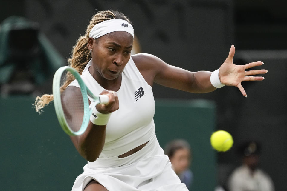 Coco Gauff of the United States plays a forehand return to compatriot Emma Navarro during their fourth round match at the Wimbledon tennis championships in London, Sunday, July 7, 2024. (AP Photo/Alberto Pezzali)